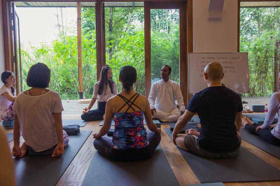 Sunil teaching a yoga class on yoga teacher training course Rishikesh